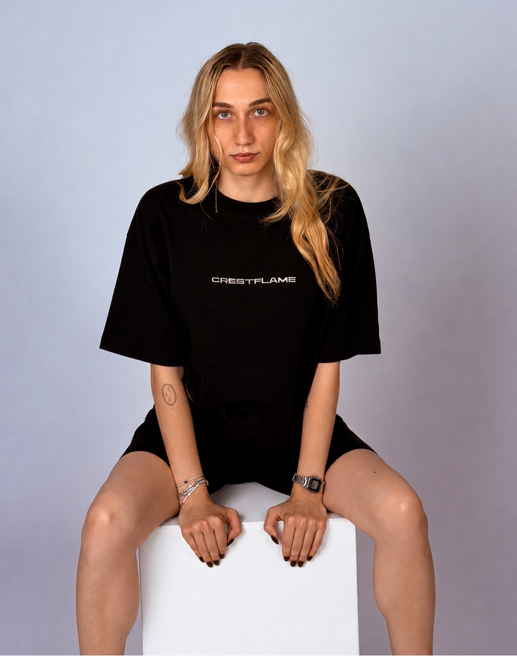 Person wearing a black t-shirt with 'CREATFLAME' text on a gray background